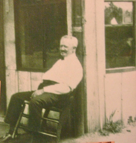 O.R. Currier resting outside the Havre de Grace Livery Stable in early 1900s